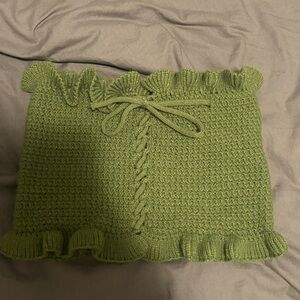 green knit top